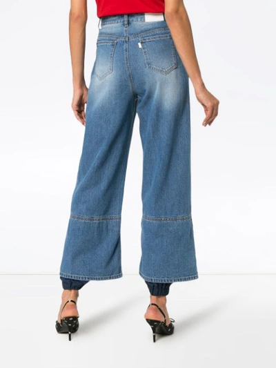 Shop Sjyp Track Pant Hem Jeans In Blue