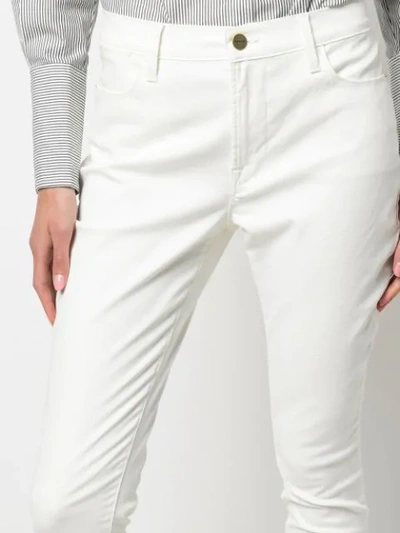Shop Frame Le High Skinny Coated Jeans In White