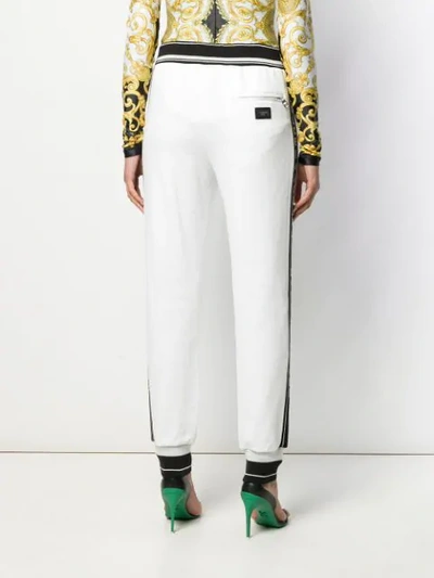 Shop Dolce & Gabbana Logo Tape Track Pants In White