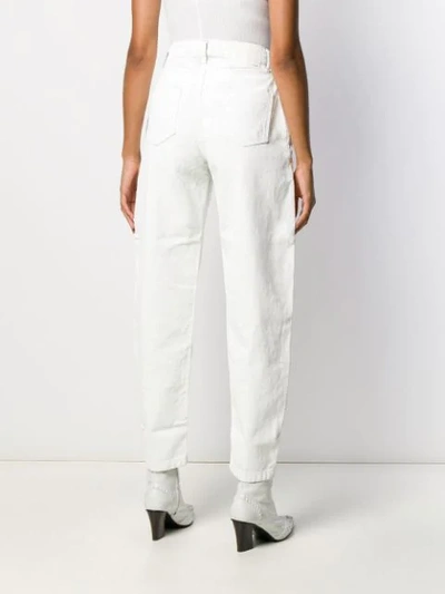 Shop Alanui High-waist Tapered Jeans In White