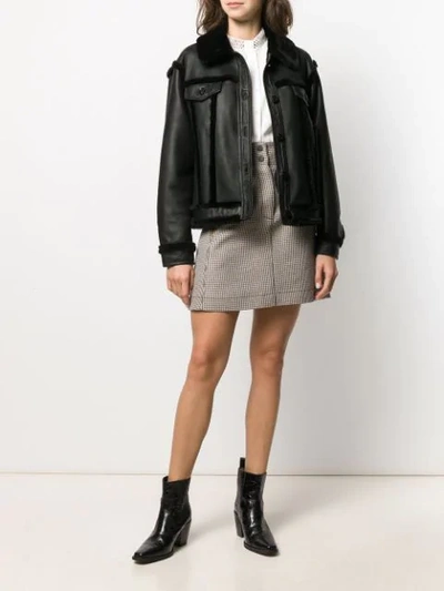 Shop Sandro Buttoned Shearling Jacket In Black