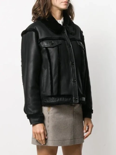 Shop Sandro Buttoned Shearling Jacket In Black