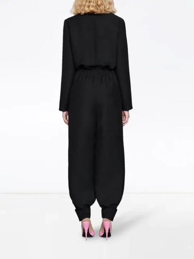 Shop Gucci Jumpsuit Mit V-ausschnitt In Black