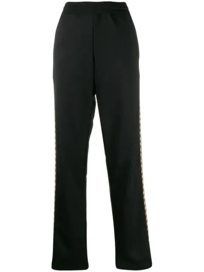 Shop Moschino Printed Side Panels Track Trousers In Black