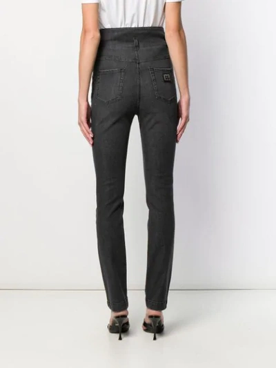 Shop Dolce & Gabbana High Waisted Button Jeans In Black