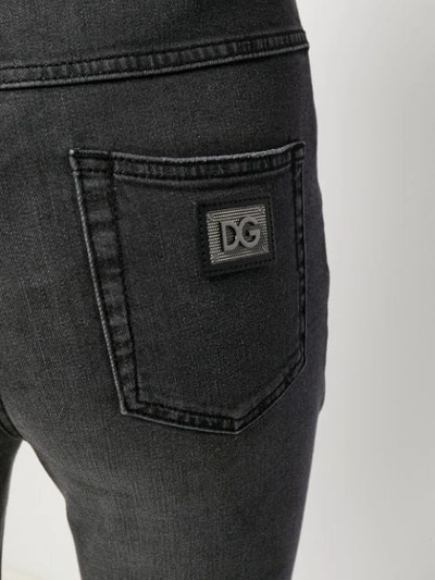 Shop Dolce & Gabbana High Waisted Button Jeans In Black