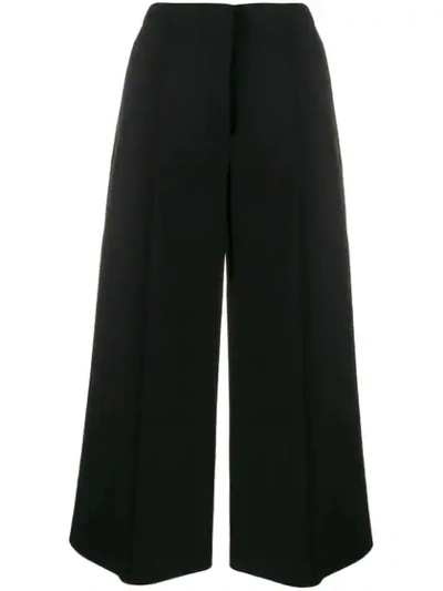 Shop Moschino Cropped Trousers In Black