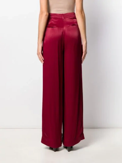 Shop Essentiel Antwerp Flared Palazzo Trousers In Red