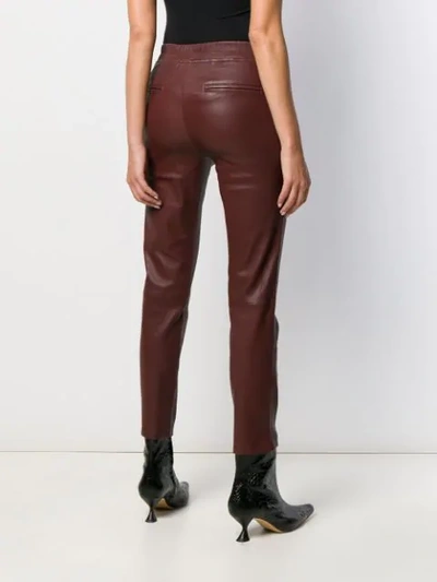 Shop Arma Trousers In Brown