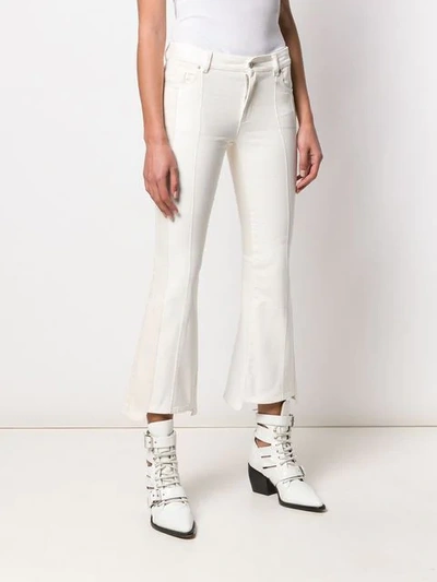 Shop Alexander Mcqueen Cropped Flared Jeans In White