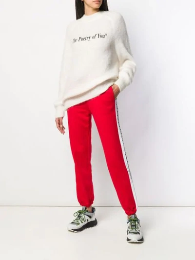 Shop Msgm Logo Tape Track Pants In Red