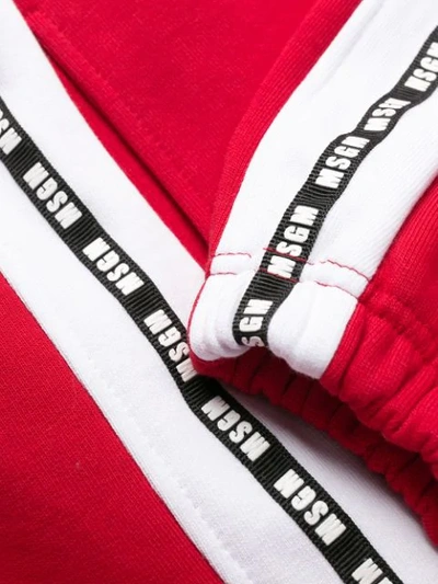 Shop Msgm Logo Tape Track Pants In Red