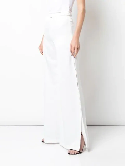 Shop Alexis Roque Trousers In White