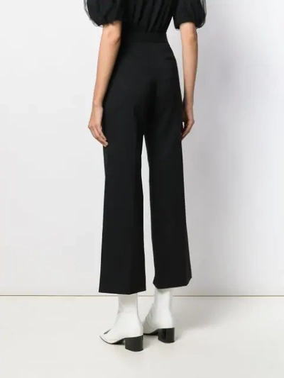 Shop Miu Miu Crystal Buckle Flared Trousers In Black