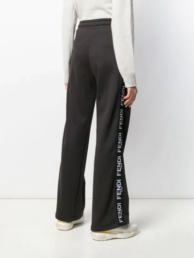 Shop Fendi Logo Stripes Track Trousers In Black