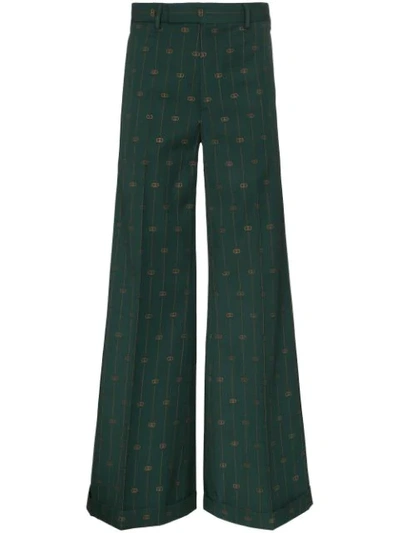Shop Gucci Pinstripe Flared Trousers In Green