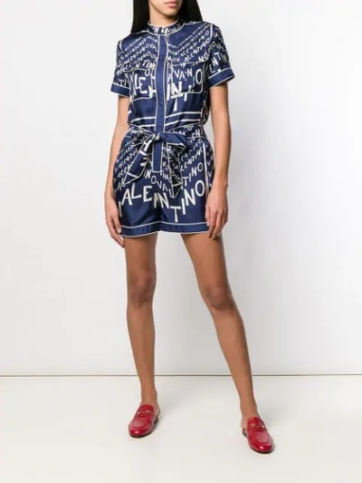 Shop Valentino Logo Printed Playsuit In Blue