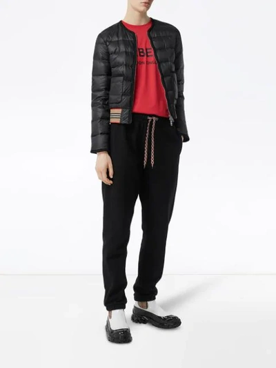 Shop Burberry Icon Stripe Detail Down-filled Puffer Jacket In Black