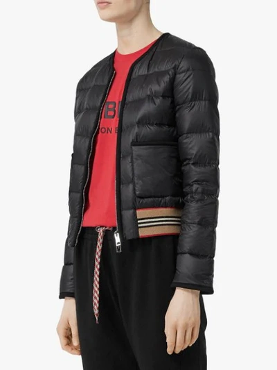 Shop Burberry Icon Stripe Detail Down-filled Puffer Jacket In Black