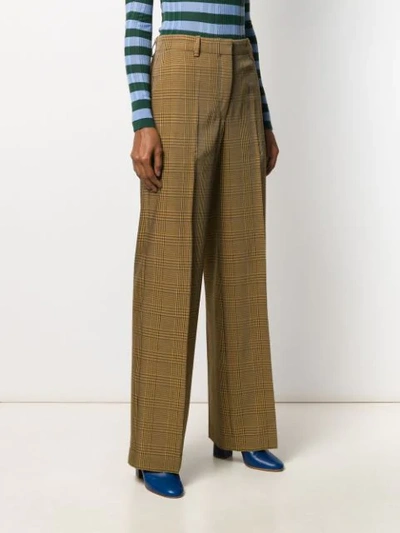 Shop Christian Wijnants Checked Print Trousers In Brown