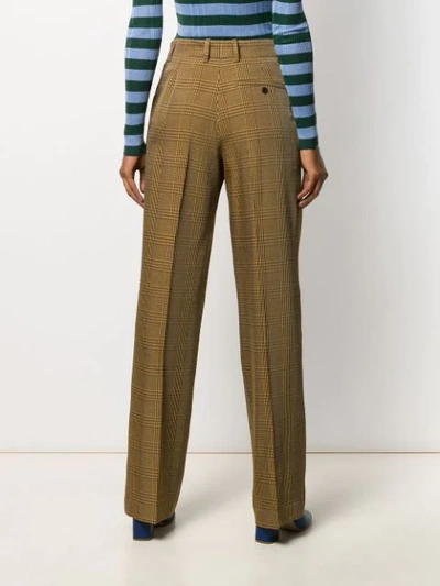 Shop Christian Wijnants Checked Print Trousers In Brown