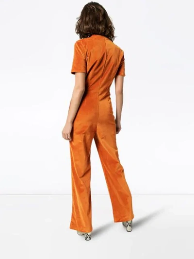 Shop Staud Zip-front Velvet Jumpsuit In Orange