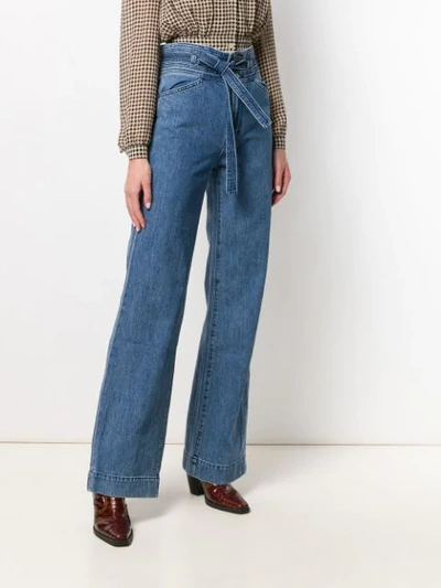 Shop J Brand Belted Flared Leg Jeans In Blue