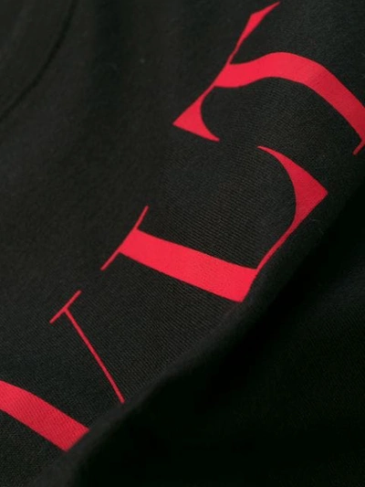 Shop Valentino Printed Logo Oversized T-shirt In Black