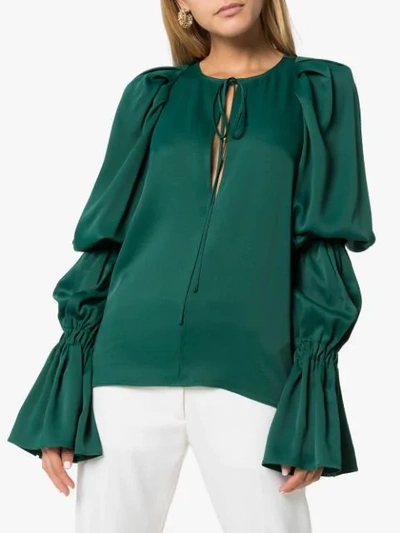 Shop Khaite Cortez Flared-sleeve Blouse In Green