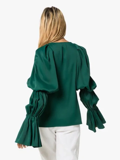 Shop Khaite Cortez Flared-sleeve Blouse In Green