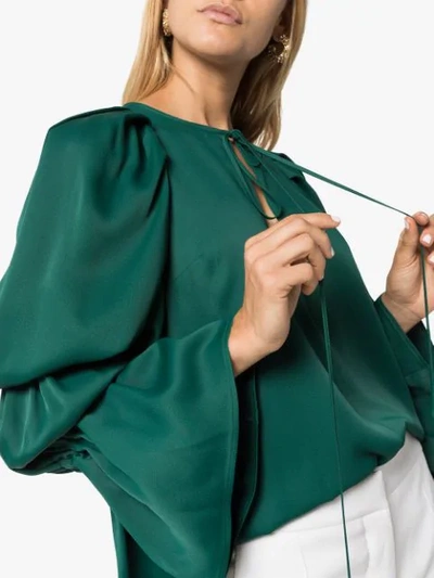 Shop Khaite Cortez Flared-sleeve Blouse In Green