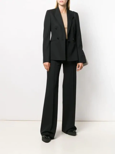 Shop Stella Mccartney Ausgestellte Hose In Black