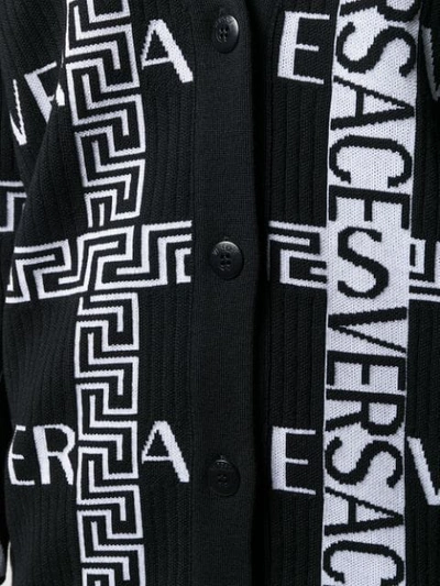 Shop Versace Greca Logo Knitted Cardigan In A2024 Nero/bianco