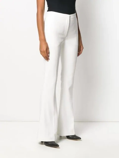 Shop Alexander Mcqueen Sharp Flared Trousers In White