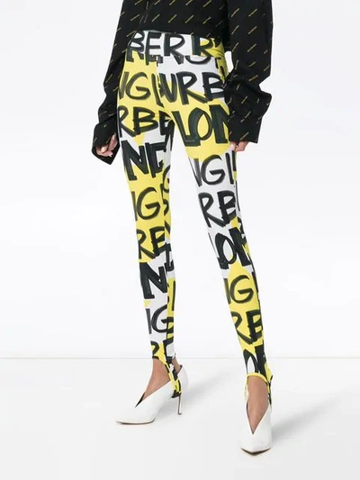 Shop Burberry Graffiti Logo Stirrup Leggings In Yellow