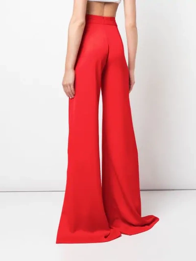 Shop Alexis Roque Slit Trousers In Red