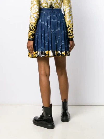Shop Versace Pleated Logo Denim Skirt In A8006