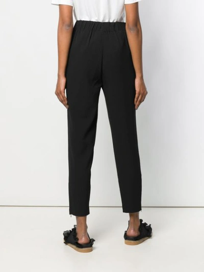 Shop Ganni Tapered Trousers In Black