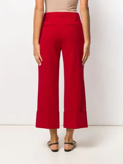 Shop Valentino Cropped Pleated Trousers In Red