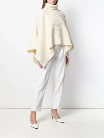 Shop Jacquemus Turtleneck Knitted Poncho In White