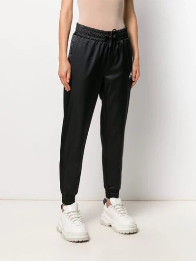 Shop Nike High-waisted Track Pants In Black