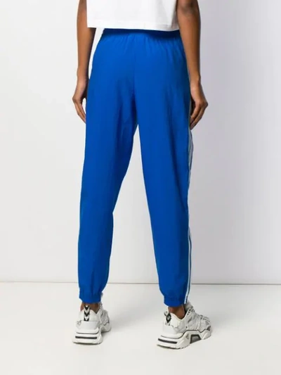 Shop Adidas Originals Stripe Panel Track Trousers In Blue