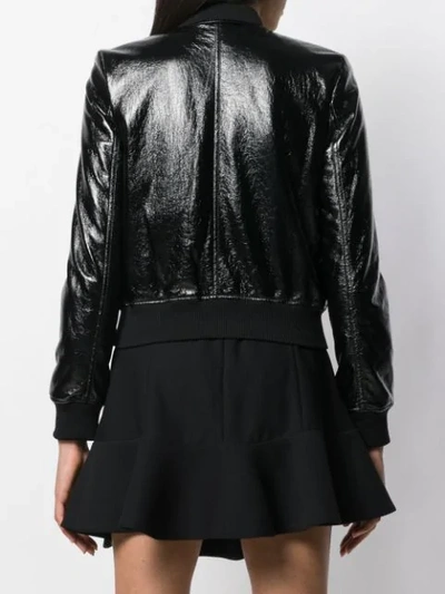 Shop Michael Kors Patent Bomber Jacket In Black