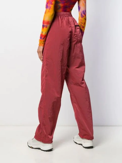 Shop Aries Logo Embroidered Track Pants In Red