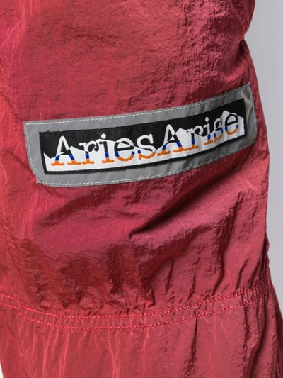 Shop Aries Logo Embroidered Track Pants In Red