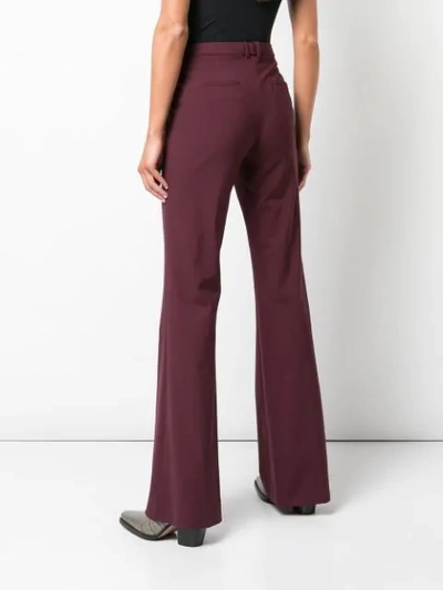 Shop Theory Flared Style Trousers In Red
