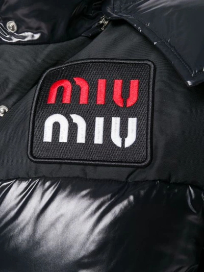 Shop Miu Miu Oversized Puffer Coat In Black