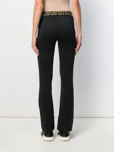 Shop Versace Greek Key Track Pants In Black