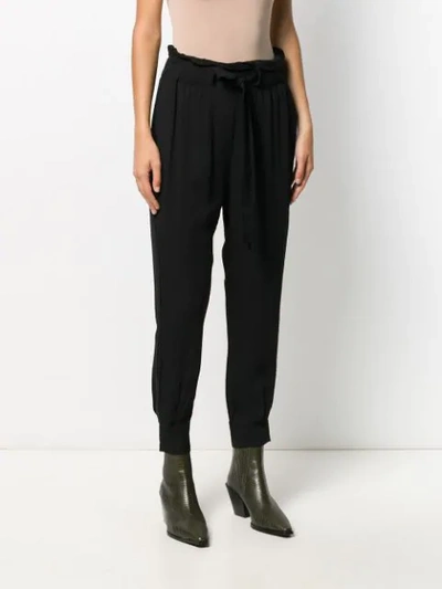 Shop Chufy Loose Fit Tapered Trousers In Black