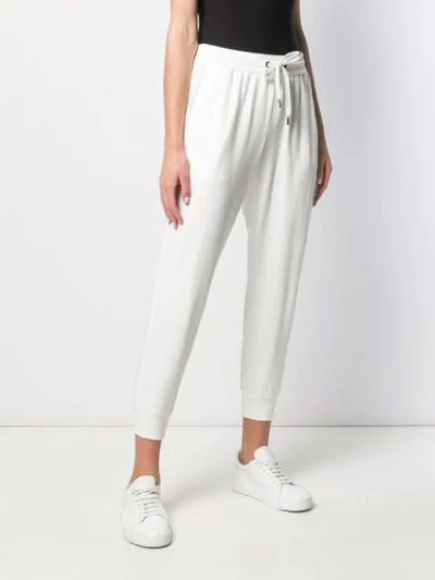 Shop Brunello Cucinelli Tapered Track Pants In White